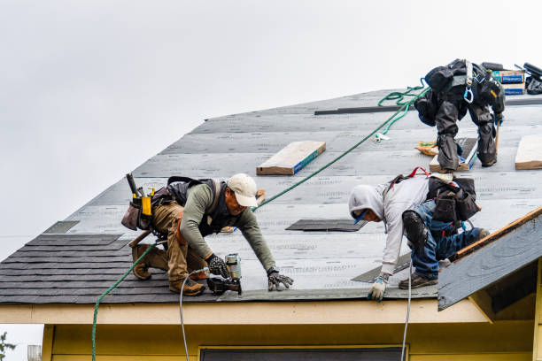 Professional Gutter Installation technician working in South Hamilton, MA